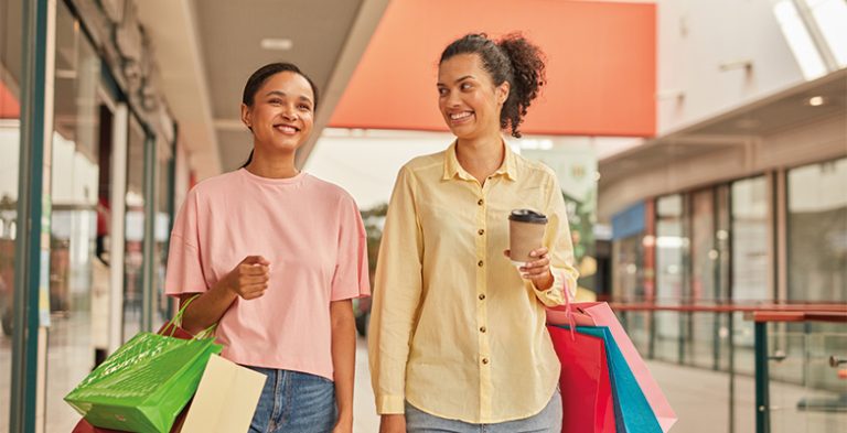 Happy Woman and Friend Shopping