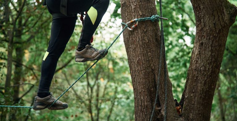 Active person walking on high rope