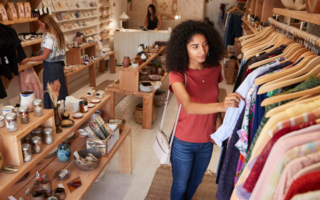 Young lady shopping in a clothes shop