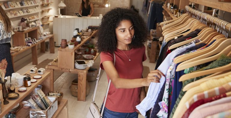 Young lady shopping in a clothes shop
