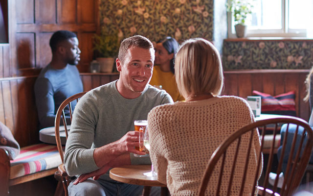 Couple relaxing in a country pub