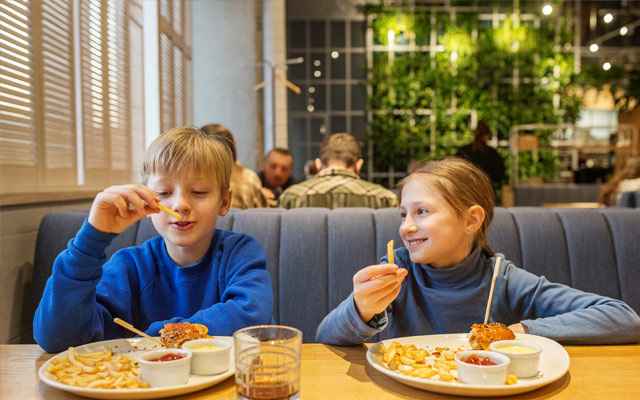 Young children enjoying a meal together