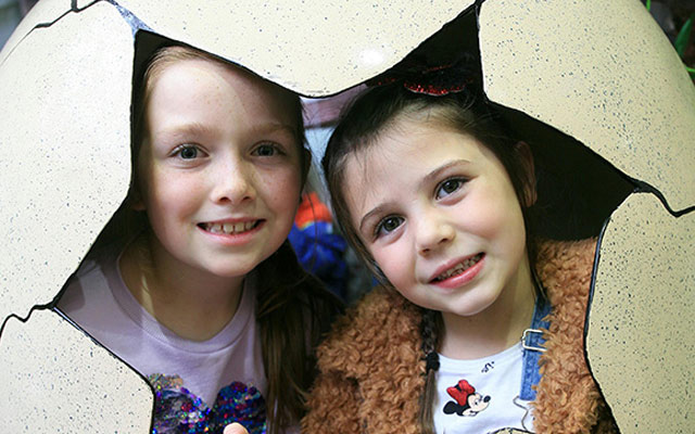Children in a dinosaur egg