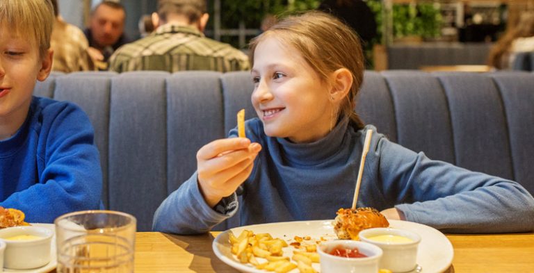 Young children enjoying a meal together