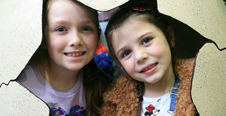 Children in a dinosaur egg