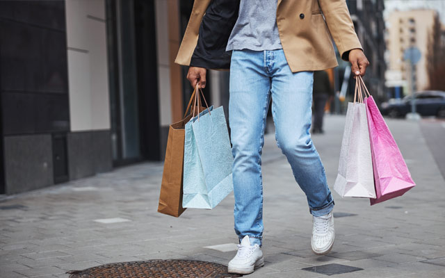 Man with bags on the high street
