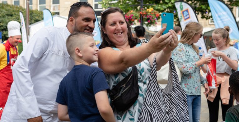 Happy family and chef at the Food Festival