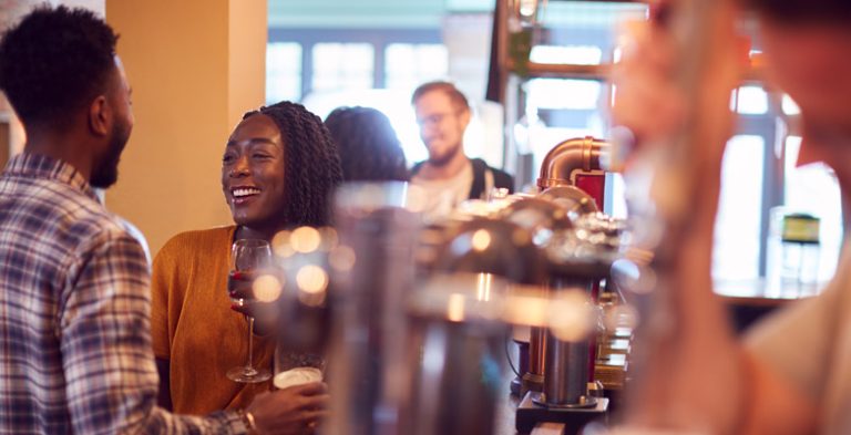 Happy young people in a bar