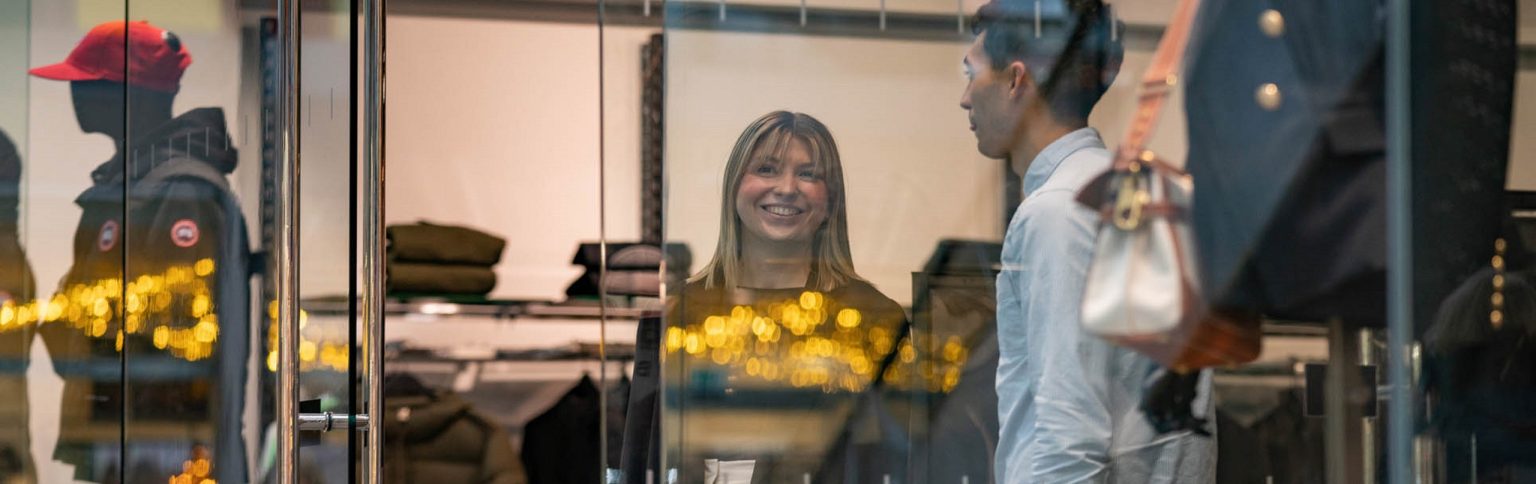 A young couple shopping and smiling